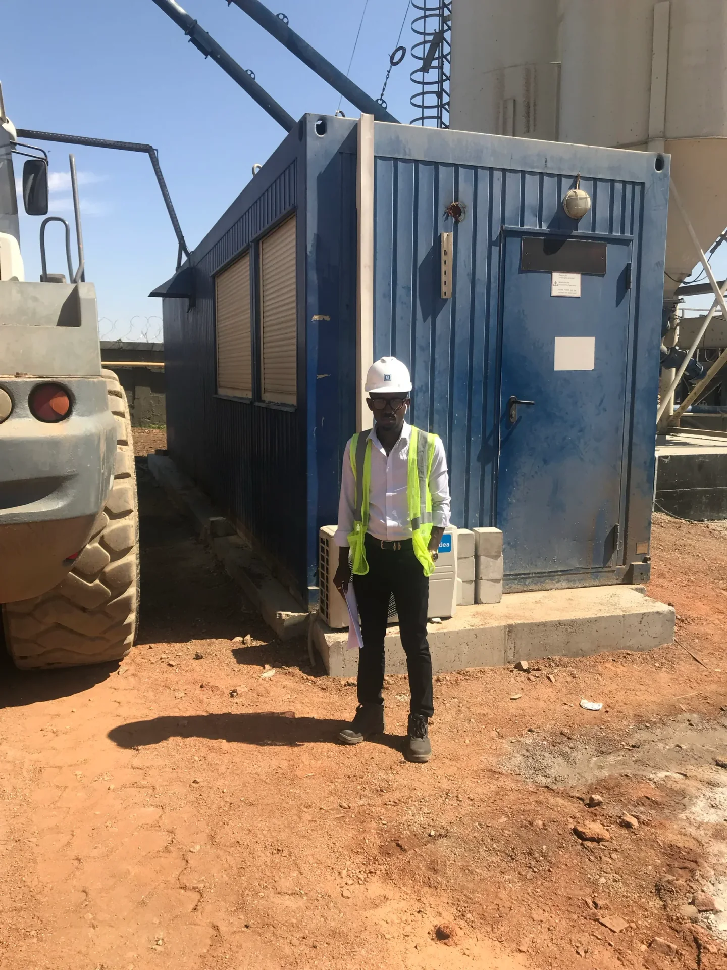 Kufre Antia wearing PPE on an active construction site